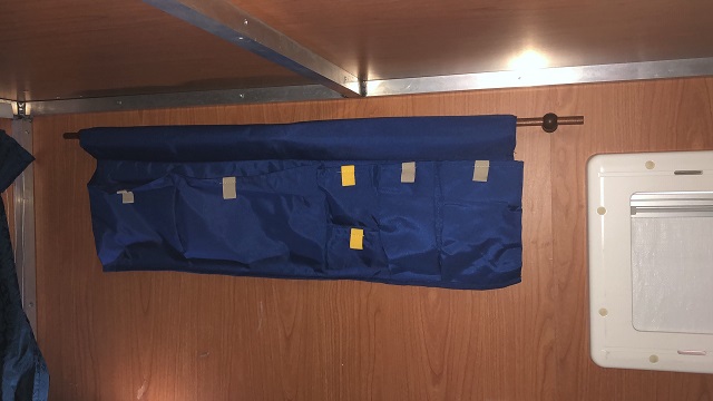 the multi-pocket gadget installed in the sleeping area 